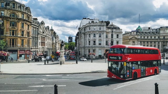 central london street with a red doubled decker bus in the foreground