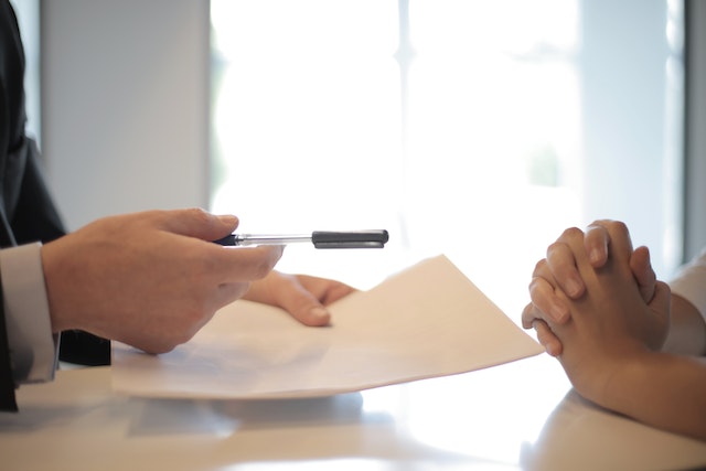 two people discussing a lease proposal document