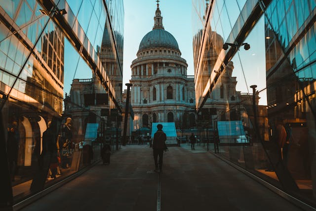 A late afternoon view of St Paul's Cathedral between the glass sides of two buildings. Image at LondonOfficeSpace.com.